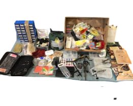 A quantity of fly tying gear including vices, tools, yarns, hackles, book on fly tying, varnishes,