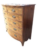 A Georgian mahogany bowfronted chest of drawers, the top above an arrangement of two short and