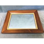 A Victorian rosewood framed mirror, the rectangular plate with gilt slip in cushion moulded