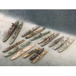 A collection of 16 cast lead waterline models of World War II warships, including destroyers,