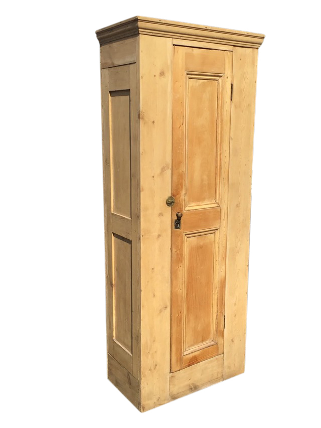 A Victorian pine wardrobe, the moulded cornice above a two-panel door with brass knob, ring handle