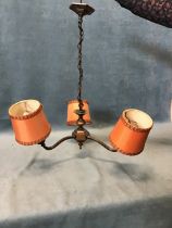An early C20th Georgian style patinated copper three-branch chandelier, with hexagonal column