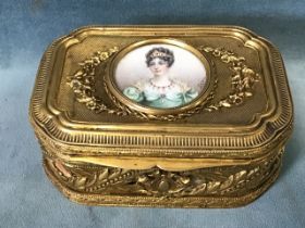 A 19th century French Palais Royal ormolu trinket box, the top inset with a miniature watercolour