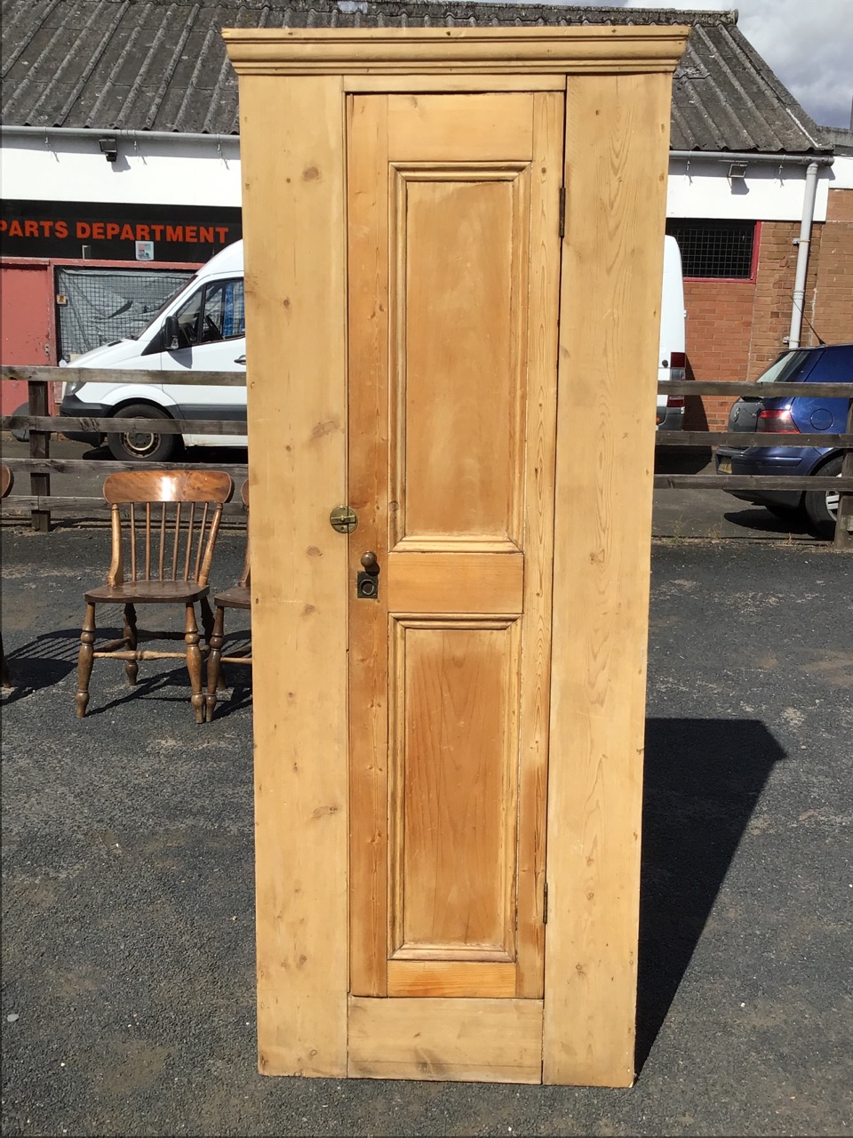 A Victorian pine wardrobe, the moulded cornice above a two-panel door with brass knob, ring handle - Image 2 of 3