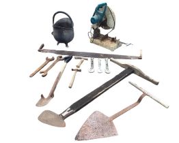 Miscellaneous tools - peat spades, spanners, a two-man log saw, a Makita bench saw, a coal scuttle