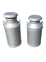 Two steel milk churns and covers by JW Davidson and Fairbairn & Sons, with handles to shoulders