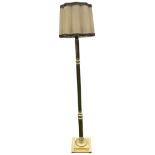 A brass standard lamp, the fluted and turned column on a square stepped base, fitted with fabric