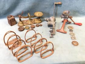 Miscellaneous metalware including four pairs of stirrups, two kitchen mincers with various blades,