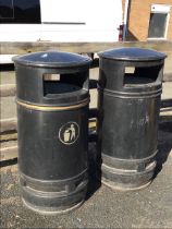 Two cylindrical litter bins with galvanised liners, the domed tops above rectangular apertures. (