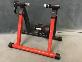 A boxed Bike Hut turbo trainer, the folding stand with six-level friction resistance for applying to