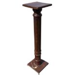 A mahogany jadiniere stand wotj square top on a turned and fluted column, the confirming base on