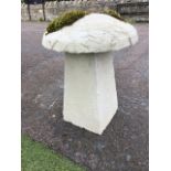 A composite saddle stone having dome shaped cover on rectangular column. (16in x 21in)