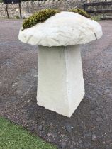 A composite saddle stone having dome shaped cover on rectangular column. (16in x 21in)