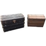 A domed top seamans chest with slats on canvas covered ground, raised on casters - 32.25in; and