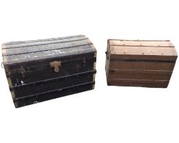 A domed top seamans chest with slats on canvas covered ground, raised on casters - 32.25in; and