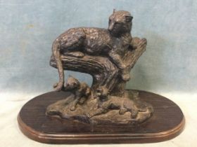 A limited edition bronzed figure of a leopard and her cubs, indistinctly signed and numbered