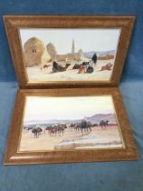 Eugine Girardet, oileographic prints, a pair, dessert scenes with camels and figures, signed in