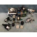 Miscellaneous spinning and multiplier reels & spools - many unused including a Penn Silverado, a