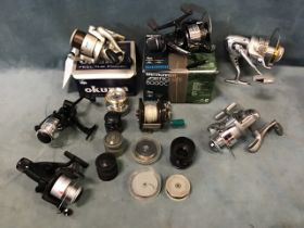 Miscellaneous spinning and multiplier reels & spools - many unused including a Penn Silverado, a