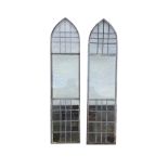 A pair of steel framed lancet windows, with leaded upper and lower panels. (18.25in x 77.5in)