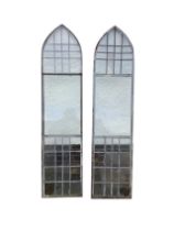 A pair of steel framed lancet windows, with leaded upper and lower panels. (18.25in x 77.5in)