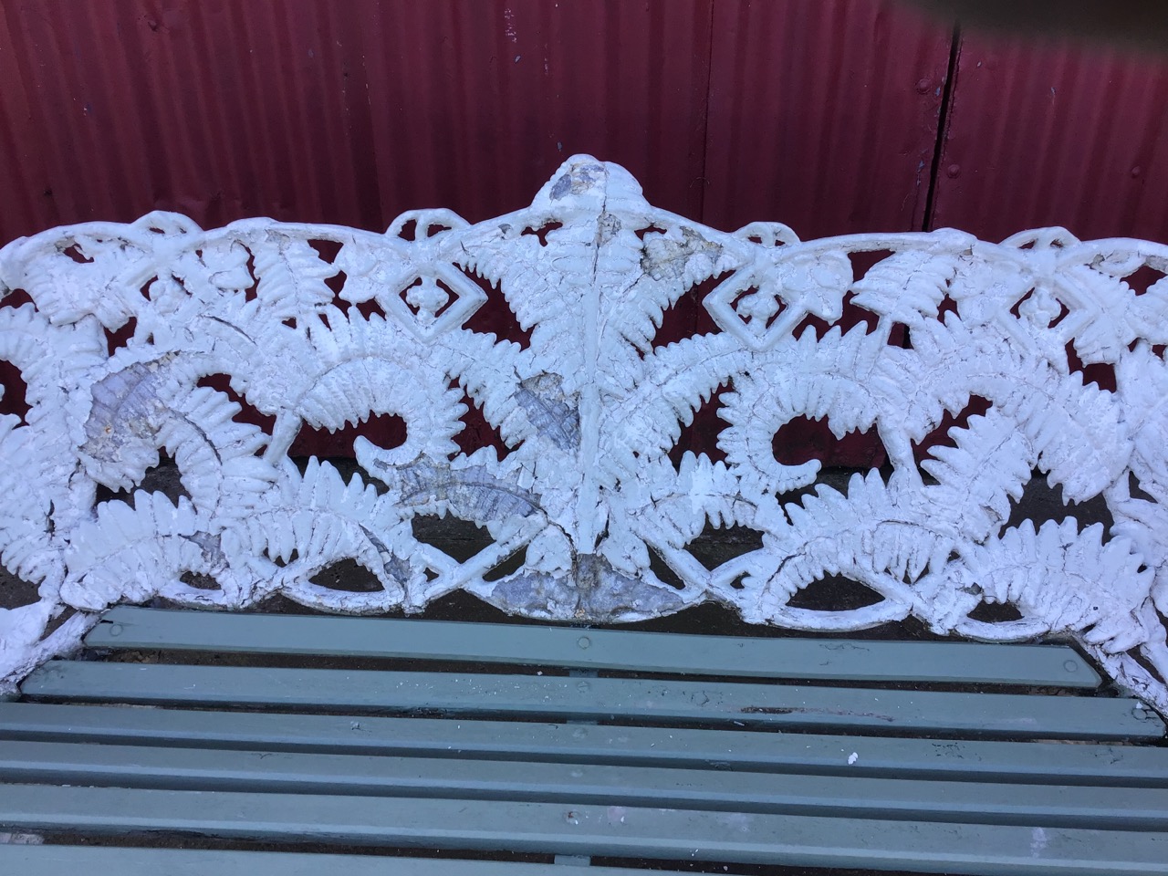 A Coalbrookdale style garden bench, in the fern and blackberry pattern, with wood slatted seat. ( - Image 2 of 3