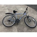 A Dawes Tourismo T22 mountain bike, with soft saddle 21-speed gears, etc.