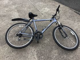 A Dawes Tourismo T22 mountain bike, with soft saddle 21-speed gears, etc.