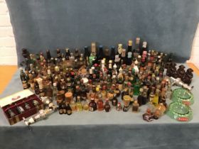 A collection of miniature bottles of alcohol - liquor, aperitifs, cider, beer, port, sherry,