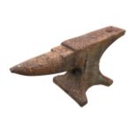 A cast iron anvil with tapering pointed nose and rectangular work platform, raised on waisted
