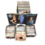 A collection of assorted vinyl LPs and 45s, including pop and rock including David Bowie, Jethro