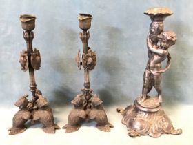 A pair of empire style candlesticks modelled with military style armour, shields and helmets