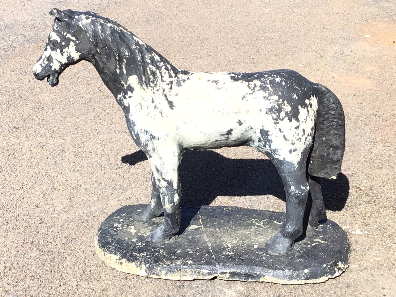 A composition stone garden figure of a standing pony. (35in x 14.5in x 27in)