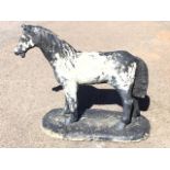 A composition stone garden figure of a standing pony. (35in x 14.5in x 27in)