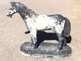 A composition stone garden figure of a standing pony. (35in x 14.5in x 27in)