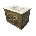 A rectangular brass log box, the top and sides with repoussé 17th century domestic scenes within