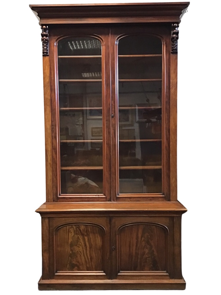 A Victorian mahogany bookcase, the moulded cornice above a pair of arched glazed doors flanked by - Image 2 of 3
