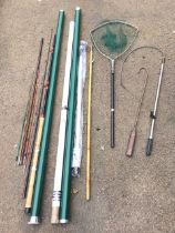 Miscellaneous fishing items including a gaff, rod tubes, a landing net, a tailer, net shafts, a