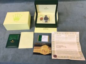 A cased stainless steel Rolex style Daytona Oyster Perpetual watch, with paperwork, certificates,