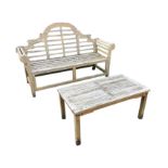 A teak Lutyens style garden bench, the back with shaped crest rail above a slatted seat, flanked