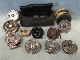 A box of miscellaneous fly reels and spools - Orvis, Balzer, an old bakelite reel, Ron Thompson