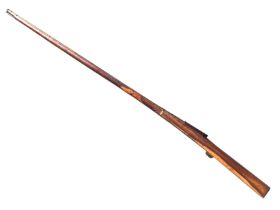 A nineteenth century Indian Mughal matchlock toradar musket with steel barrel on a redwood stock