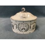 A late 18th century Leeds Pottery covered caddy, moulded with armorial shields, saints and ships