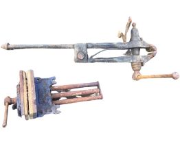 A Record heavy cast iron bench vice; and a metalworking pincer vice. (2)