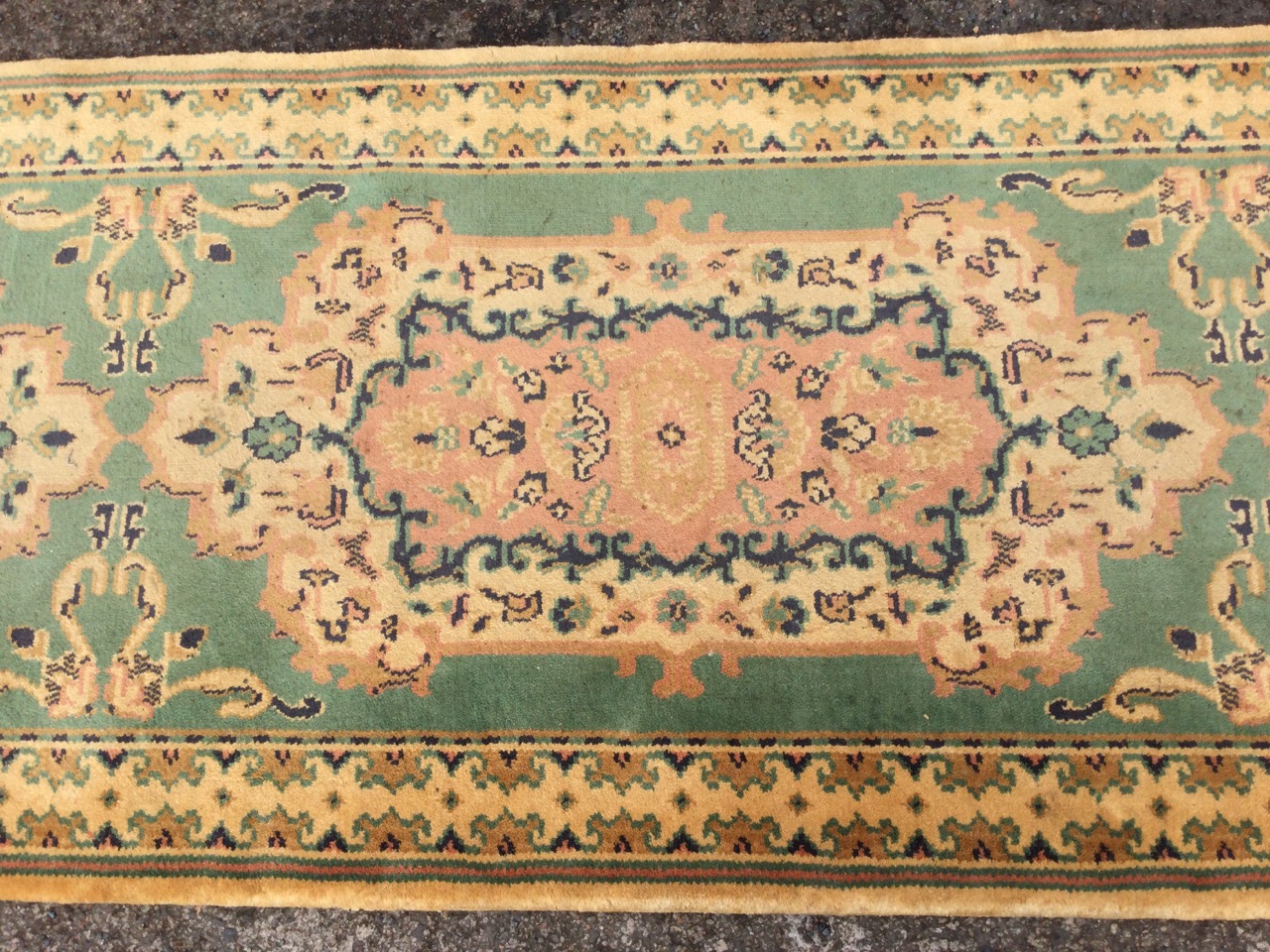 A Persian style wool runner, the green field with three floral medallions and scrolled foliate - Image 2 of 3