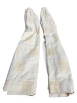 A pair of lined cream-coloured curtains with woven celtic knot square panelled design. (81.5in) (2)