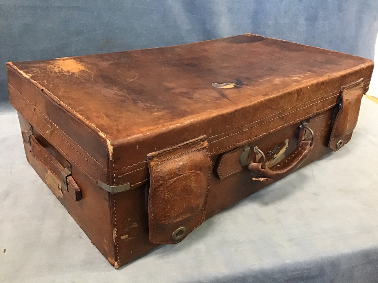 An early 20th century leather suitcase, by Dog Brand, Shanghai, with nickel fittings and leather - Image 2 of 3