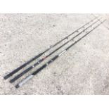 A South Bend 9ft composite graphite Black Beauty two-piece spinning rod; a Shakespeare Contender 9ft