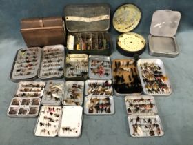 A collection of fishing flies in Wheatley boxes, a Hardys leather cast wallet, dry flies,