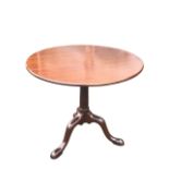 A mid-18th century mahogany tilt-top table, the circular top on a birdcage support, the turned